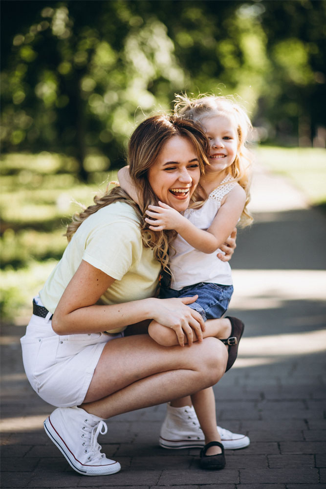 a mom is hugging a child